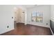 Bright, open-concept living room with hardwood floors and ample natural light from a large window at 3225 Rex Ridge Dr, Rex, GA 30273
