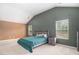 Vaulted main bedroom with plush carpeting, large windows, and neutral color scheme at 3225 Rex Ridge Dr, Rex, GA 30273