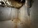Unfinished basement with concrete walls and exposed pipes at 1822 Millwood Park Ct, Buford, GA 30518