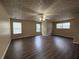 Bedroom with vinyl flooring, ceiling fan and a window with blinds at 1822 Millwood Park Ct, Buford, GA 30518
