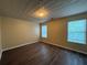 Bedroom with hardwood floors and two windows at 1822 Millwood Park Ct, Buford, GA 30518