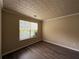 Bedroom with vinyl flooring and a window with blinds at 1822 Millwood Park Ct, Buford, GA 30518