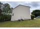 Exterior showcasing a large yard and central air conditioning units at 1822 Millwood Park Ct, Buford, GA 30518
