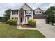 Charming two-story home with manicured lawn and attached two-car garage at 1822 Millwood Park Ct, Buford, GA 30518