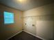 Laundry room with vinyl flooring, window and wire shelf at 1822 Millwood Park Ct, Buford, GA 30518