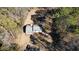 Aerial view showcasing a home nestled among mature trees on a generous lot, perfect for privacy at 2248 Bethel Rd, Conyers, GA 30012