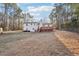 Expansive backyard showcasing a two-story white home with a deck, perfect for outdoor enjoyment at 2248 Bethel Rd, Conyers, GA 30012