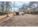 Spacious backyard featuring a storage shed and two-story home, offering ample space for outdoor activities at 2248 Bethel Rd, Conyers, GA 30012