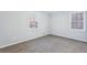 Bedroom featuring light gray walls, baseboard trim, a double hung window, and outlets at 2248 Bethel Rd, Conyers, GA 30012
