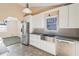 Open kitchen layout with modern appliances and a farmhouse sink at 2248 Bethel Rd, Conyers, GA 30012
