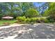Expansive backyard with a concrete patio, stairs, lush greenery, and space for outdoor enjoyment at 2965 Pharr Court South Nw # 1-817, Atlanta, GA 30305
