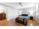 Spacious bedroom featuring hardwood floors, ceiling fan, and ample natural light at 2965 Pharr Court South Nw # 1-817, Atlanta, GA 30305