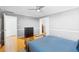 Cozy bedroom featuring hardwood floors and neutral walls, with closet access at 2965 Pharr Court South Nw # 1-817, Atlanta, GA 30305