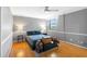 Comfortable bedroom with hardwood floors and ceiling fan at 2965 Pharr Court South Nw # 1-817, Atlanta, GA 30305