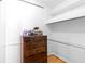 Organized walk-in closet with shelving for optimal storage at 2965 Pharr Court South Nw # 1-817, Atlanta, GA 30305
