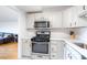Updated kitchen featuring stainless steel appliances and white cabinets with modern hardware at 2965 Pharr Court South Nw # 1-817, Atlanta, GA 30305