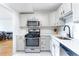 Updated kitchen featuring stainless steel appliances and white cabinets with modern hardware at 2965 Pharr Court South Nw # 1-817, Atlanta, GA 30305