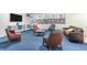 Large living room with custom built-in bookshelves, a leather sofa, and comfortable seating arrangement at 2965 Pharr Court South Nw # 1-817, Atlanta, GA 30305