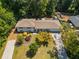 Aerial view of a home highlighting the landscaping, roof, driveway, and surrounding neighborhood at 3331 Doyle Sw Ln, Marietta, GA 30060