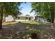 Large backyard featuring a shed, patio with furniture, and ample space for outdoor activities at 3331 Doyle Sw Ln, Marietta, GA 30060