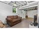 Finished basement featuring a sofa and natural light from windows, with an unfinished ceiling and painted walls at 3331 Doyle Sw Ln, Marietta, GA 30060
