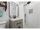 Modern bathroom featuring a stone tiled floor, black fixtures and white subway tiles at 3331 Doyle Sw Ln, Marietta, GA 30060