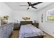Bedroom featuring a large window, ceiling fan and hardwood floors at 3331 Doyle Sw Ln, Marietta, GA 30060