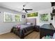Bedroom featuring a large window, ceiling fan and hardwood floors at 3331 Doyle Sw Ln, Marietta, GA 30060