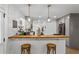 Charming kitchen with a wooden bar and stool seating, perfect for casual dining and entertaining at 3331 Doyle Sw Ln, Marietta, GA 30060