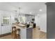 Well-lit kitchen featuring modern appliances, bar seating, and an adjacent door for easy outdoor access at 3331 Doyle Sw Ln, Marietta, GA 30060