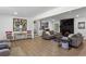 Spacious living room featuring wood flooring, comfortable sofas, and a decorative brick fireplace at 3331 Doyle Sw Ln, Marietta, GA 30060