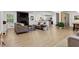 Open living room with wood flooring, comfortable seating, and seamless flow to the kitchen and dining area at 3331 Doyle Sw Ln, Marietta, GA 30060