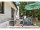 Covered patio area with outdoor furniture and seating, ideal for enjoying the backyard views at 3331 Doyle Sw Ln, Marietta, GA 30060