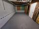 Unfinished basement with painted walls, door to another room, and exposed insulation at 71 Streamview Trl, Douglasville, GA 30134