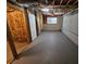 Spacious unfinished basement with exposed ductwork, a door, and a window at 71 Streamview Trl, Douglasville, GA 30134