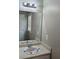 Neutral bathroom with a large mirror, vanity and sink with good lighting at 71 Streamview Trl, Douglasville, GA 30134
