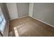 Another bedroom featuring dual doors and carpet flooring at 71 Streamview Trl, Douglasville, GA 30134