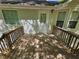 Open back deck with two windows overlooking the green backyard at 71 Streamview Trl, Douglasville, GA 30134