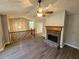 Inviting living room with hardwood floors, stone fireplace, and a staircase at 71 Streamview Trl, Douglasville, GA 30134