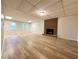 Basement featuring fireplace, tile floors, and natural light at 894 Oak Rd, Lawrenceville, GA 30044