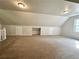 Large bonus room featuring neutral colored walls and carpet at 894 Oak Rd, Lawrenceville, GA 30044