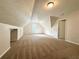 Large bonus room featuring neutral colored walls and carpet at 894 Oak Rd, Lawrenceville, GA 30044