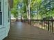 Enjoy the spacious wooden deck overlooking the wooded backyard at 894 Oak Rd, Lawrenceville, GA 30044