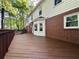 Large wooden deck wraps around the home, perfect for entertaining at 894 Oak Rd, Lawrenceville, GA 30044