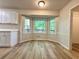 Bright dining nook area with a bay window offering peaceful outdoor views at 894 Oak Rd, Lawrenceville, GA 30044
