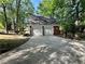 Detached two-car garage with a brick facade and concrete driveway at 894 Oak Rd, Lawrenceville, GA 30044