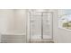 Bathroom featuring a bathtub and glass enclosed shower at 1416 Clear Pond Lane, Dacula, GA 30019