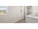 Bathroom with view to another room with ceiling fan and community at 1416 Clear Pond Lane, Dacula, GA 30019