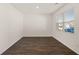 Bedroom featuring neutral walls, wood-look floors, and a window at 1416 Clear Pond Lane, Dacula, GA 30019