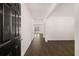 Entryway with dark wood-look floors and a dark front door at 1416 Clear Pond Lane, Dacula, GA 30019